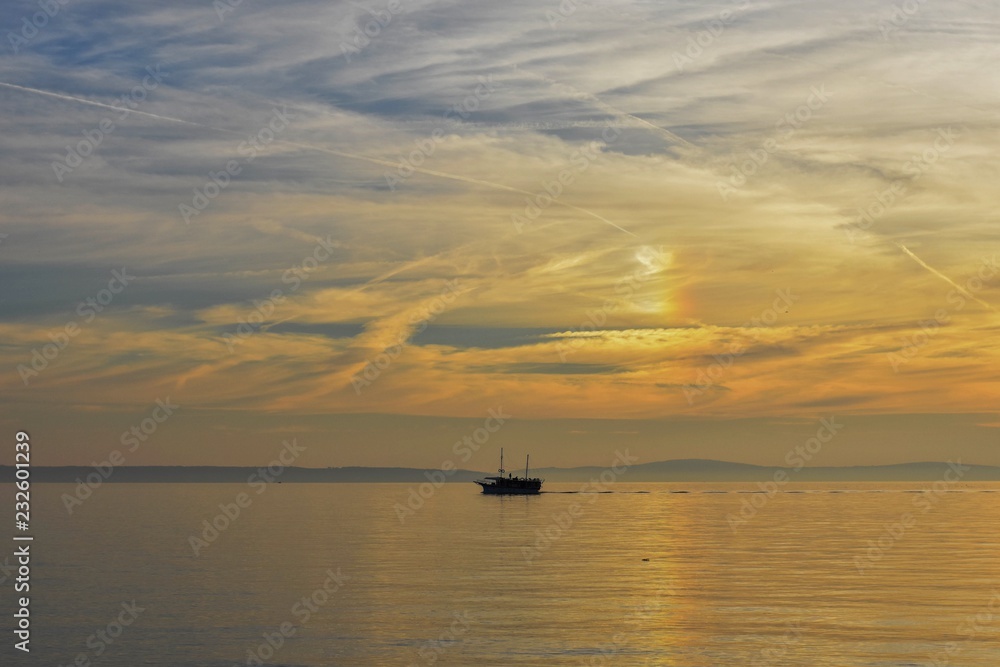 Lonely boat whit sunset