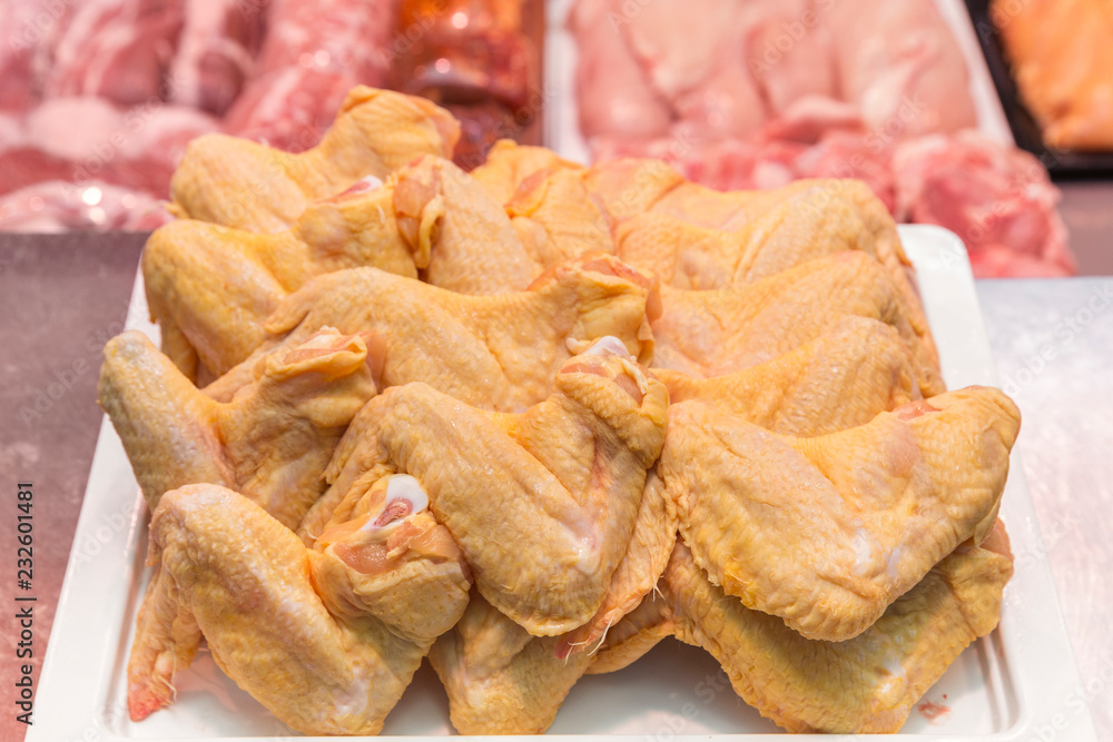 Fresh chicken for sale on a butcher shop Fresh chicken for sale on a butcher shop