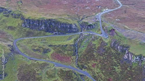 Aerial view of the Quiraing mountain pass road during sunrise on the eastern face of Meall na Suiramach, Isle of Skye, Highland, Scotland, UK photo