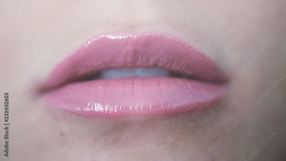 Close up beautiful sensual pink lips of young girl Close up beautiful sensual pink lips of young girl