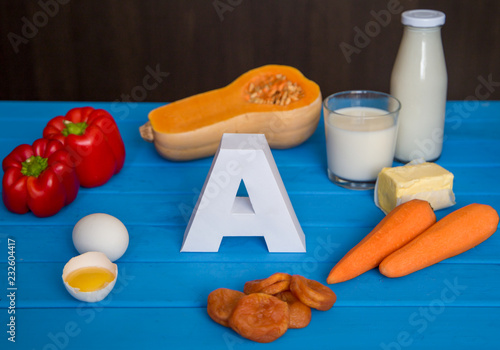 Food sources of natural vitamin A and letter A. Front view. Healthy diet concept photo