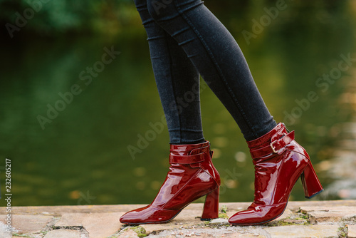 Female legs in brown leather boots outdoors