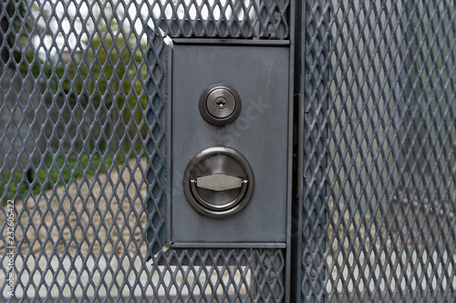 chain link fence and metal door with lock