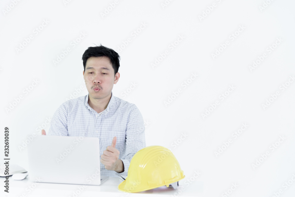 Asian employee engineer salary man sitting at desk and working with feeling successful and victory, isolated on white background. Asian employee engineer salary man sitting at desk and working with feeling successful and victory, isolated on white background.