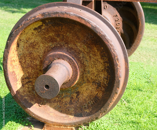The wheel covered with rust from the car of the old railway