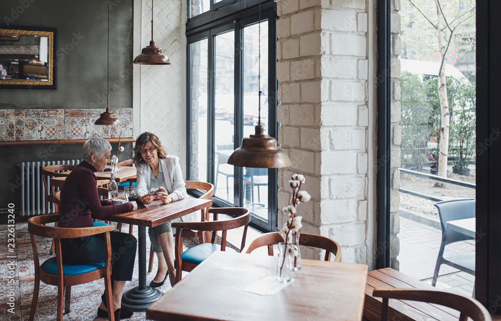 Women Chatting at Cafe