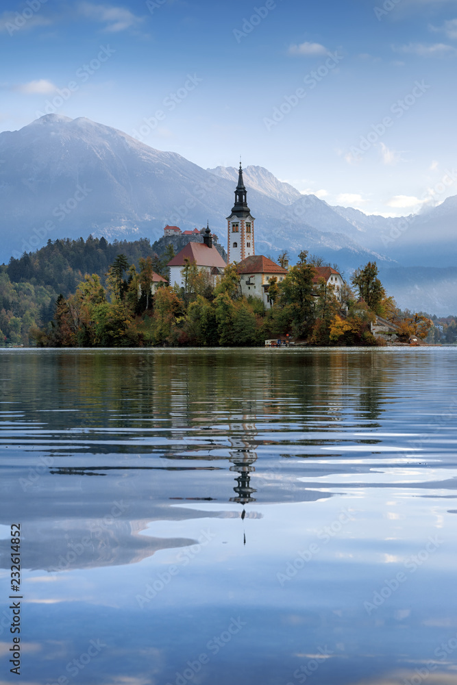 Beautiful landscape of famous mountain lake Bled in Slovenia with small church on green island Beautiful landscape of famous mountain lake Bled in Slovenia with small church on green island