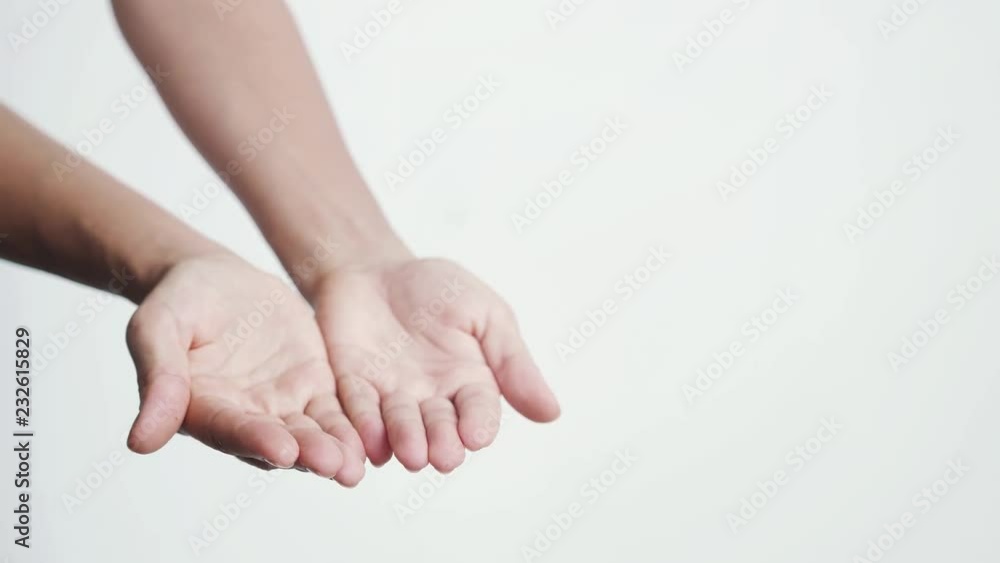Putting female hands together and showing them towards camera on a white bakground. 3840x2160 Putting female hands together and showing them towards camera on a white bakground. 3840x2160