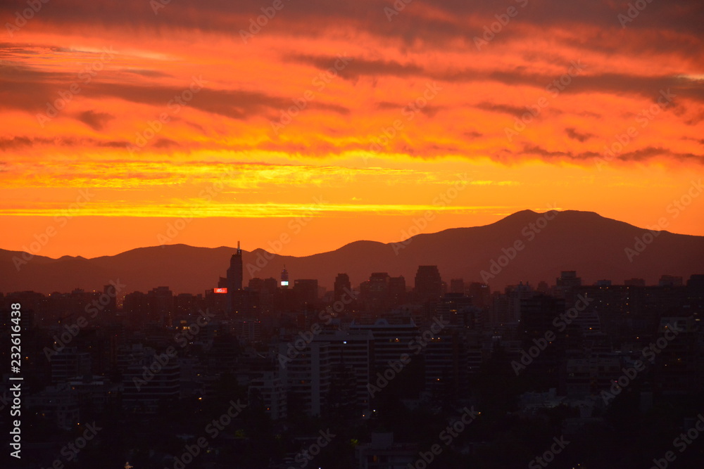 Fototapeta premium Sunset clouds and cityscape