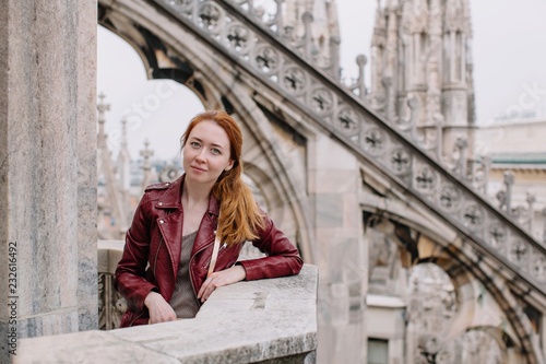 Young redhead girl on Milan Duomo roof