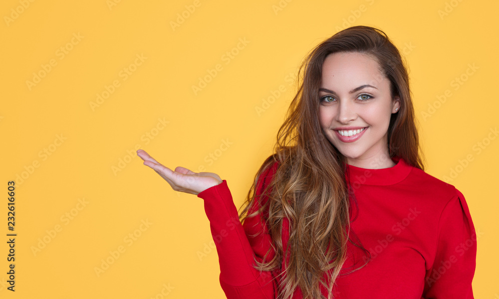 Cheerful woman presenting empty space Cheerful woman presenting empty space