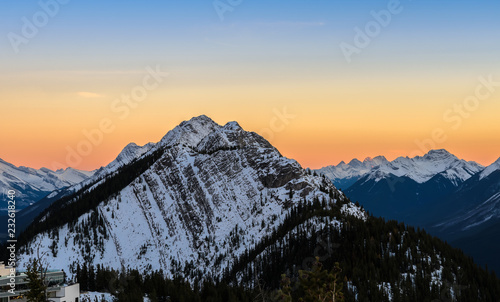 Sunset scenery of snow capped Canadian Rocky mountains at Banff National Park in Alberta, Canada