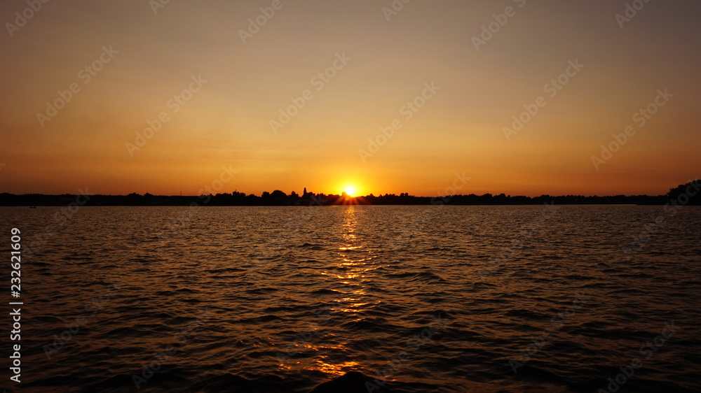 Naklejka premium sunset on the river