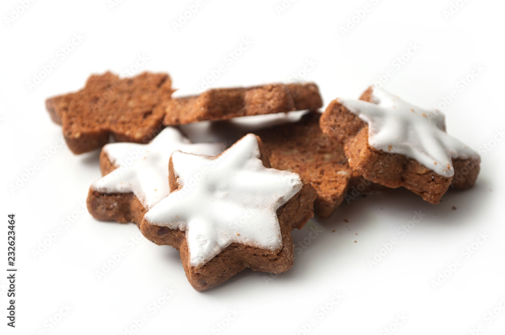 closeup of christmas biscuit in shaped star on white background closeup of christmas biscuit in shaped star on white background
