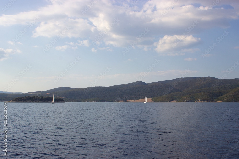 Sailing boats in a race near Vathiavali beach in Aitoloakarnania in Greece Sailing boats in a race near Vathiavali beach in Aitoloakarnania in Greece