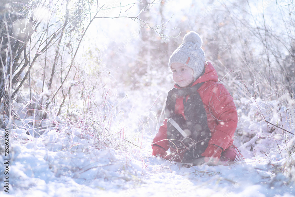 Kids walk in the park first snow Kids walk in the park first snow