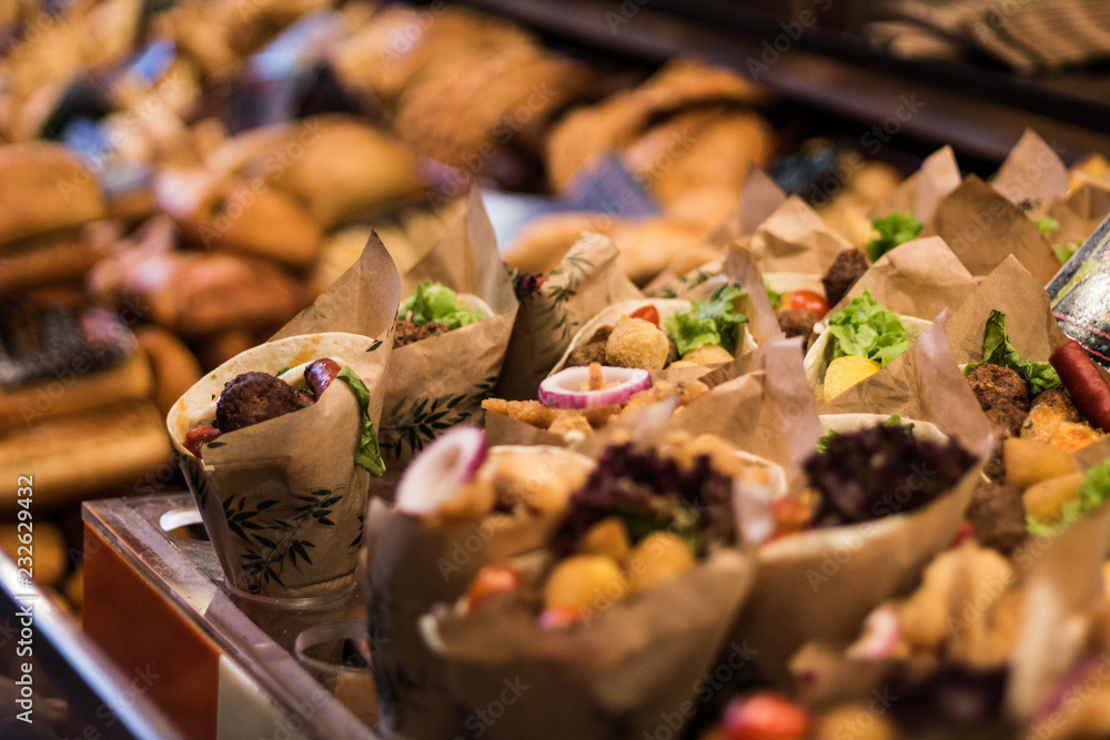 Takeaway. Paper cones with prepared food. Market store Takeaway. Paper cones with prepared food. Market store