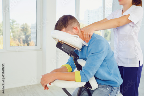 Massage on the massage chair in the office.  photo