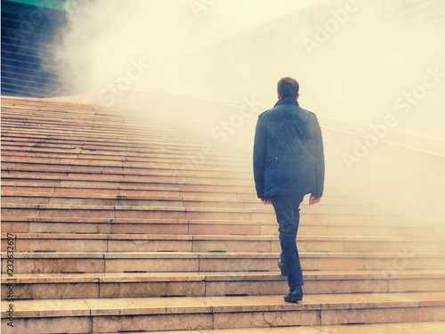 Tableau sur toile men climbing stairs in the fog to uncertain future