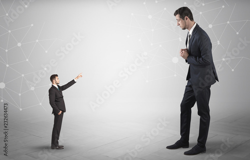 Small businessman aiming at a big businessman with connection and network concept 