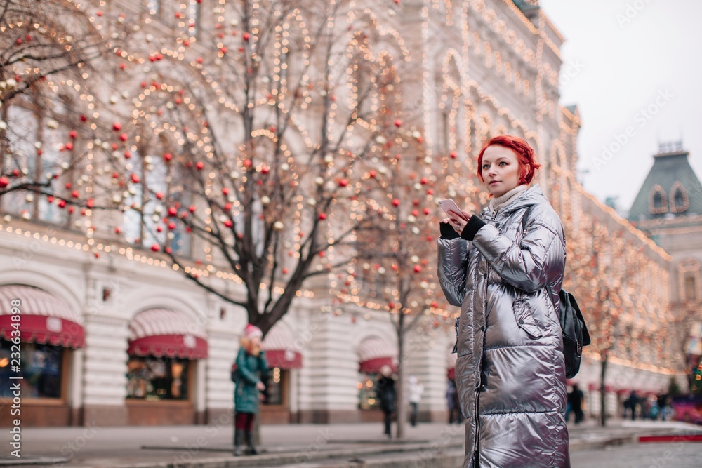 Tourist young fashionable woman standing near the GUM Moscow in winter time Tourist young fashionable woman standing near the GUM Moscow in winter time