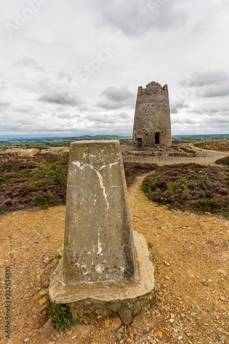 Trig post and derelict stone windmill, Parys Mountain. photo