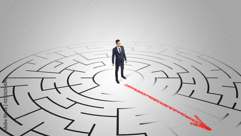 Businessman going through the maze with red arrow
Businessman going through the maze with red arrow