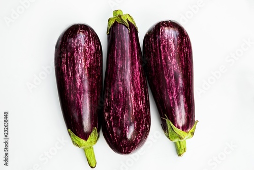 Wallpaper Mural Three aubergines isolated on white background. Torontodigital.ca