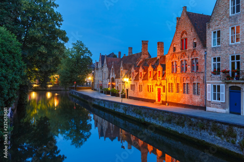 Scenic night cityscape of medieval Old town and the Green canal, Groenerei, in Bruges, Belgium photo