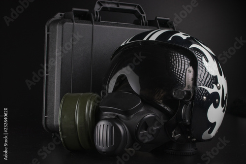 photo on black background of aviation helmet and other accessories