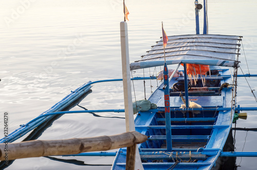 BATANGAS, PHILIPPINES - DECEMBER 25, 2015: Tourist Boat Parked at Lakeshore that cater to interisland travellers. photo