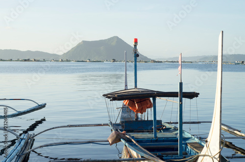 Tourist Boat Parked at Lakeshore that cater to interisland travellers photo