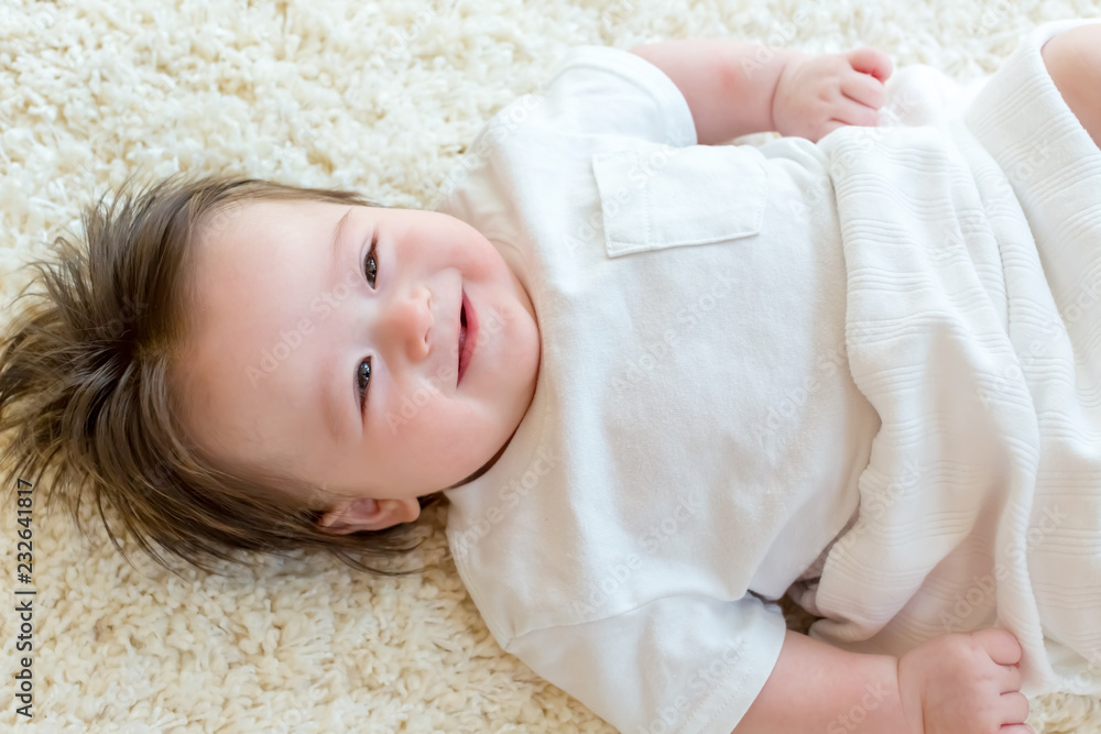 Happy baby boy with being cared for by his parents Happy baby boy with being cared for by his parents