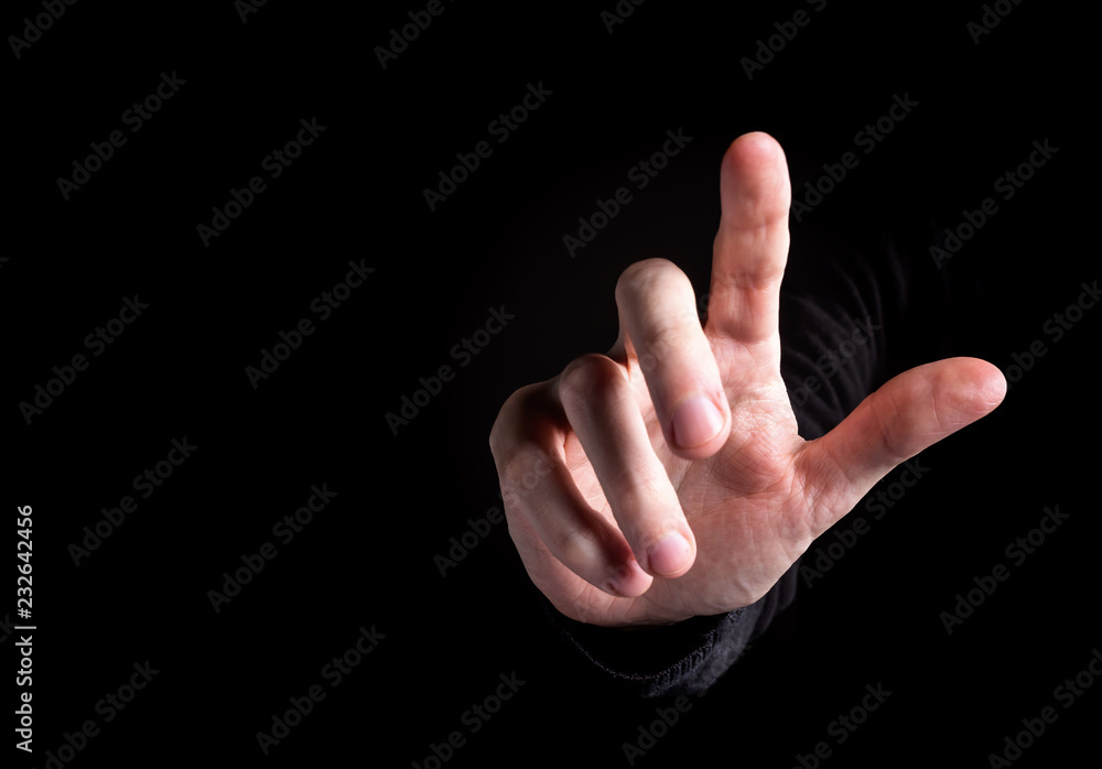 Man pointing or pressing something on black background Man pointing or pressing something on black background