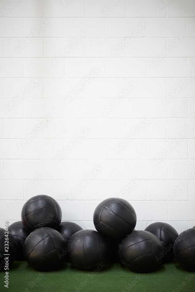 Group of weight balls for exercises in a fitness club or gym Group of weight balls for exercises in a fitness club or gym