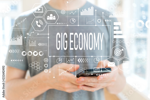 Gig economy with young man using a smartphone