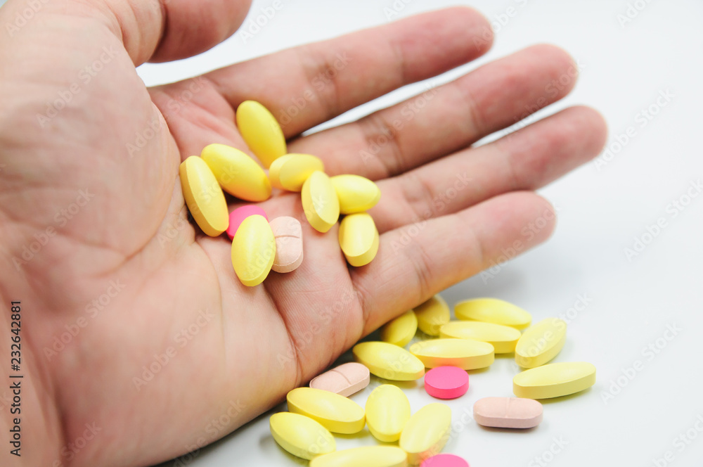 Colorful pills and medicines in the hand Colorful pills and medicines in the hand
