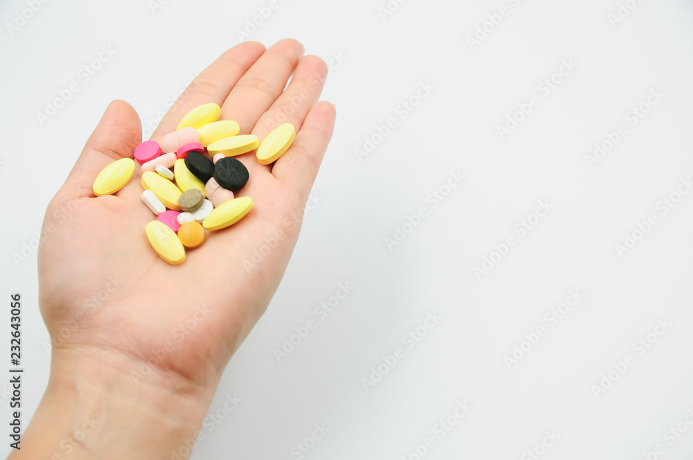 Colorful pills and medicines in the hand Colorful pills and medicines in the hand