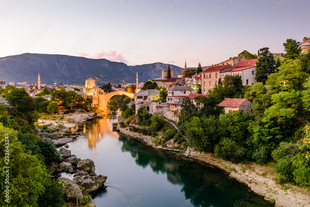 Sightseeing in Bosnia and Herzegovina. The Old Bridge, Stari Most, with emerald river Neretva in Mostar old town, night view

