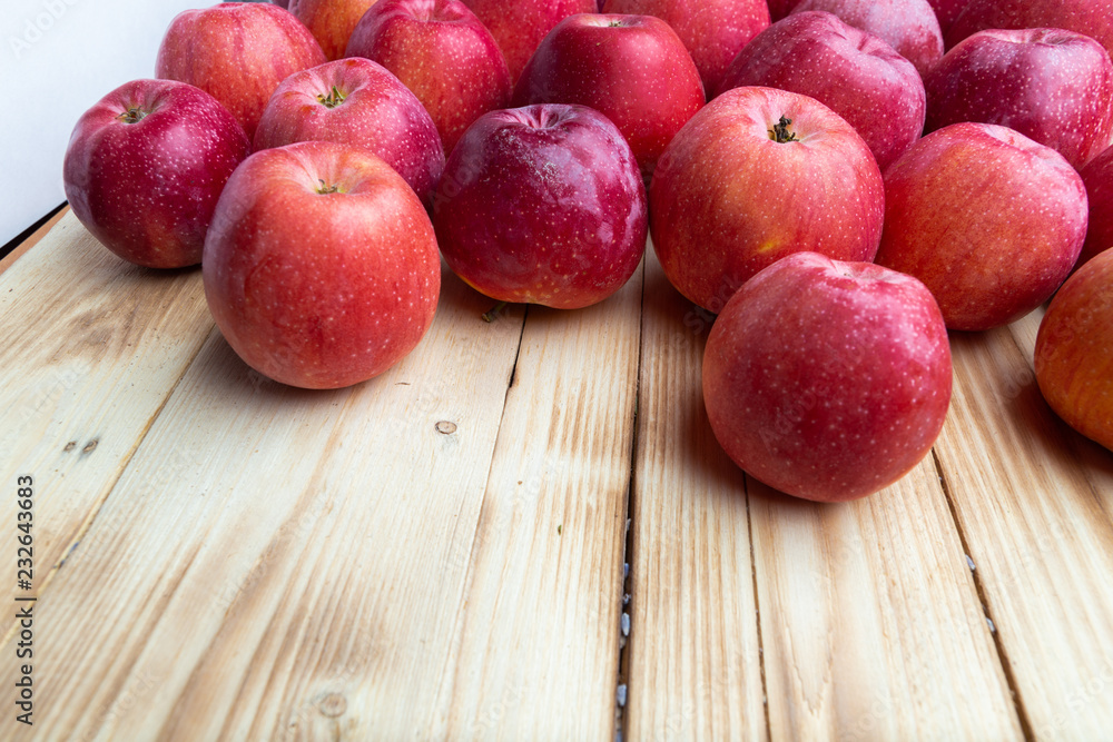 heap of unwashed unclean red apples mix on wooden background, top side view closeup heap of unwashed unclean red apples mix on wooden background, top side view closeup