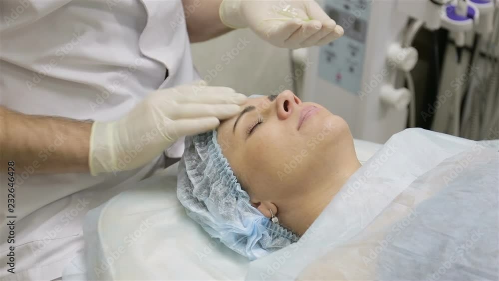 Woman taking procedure of deep face cleaning in beauty salon. Skin treatment Woman taking procedure of deep face cleaning in beauty salon. Skin treatment