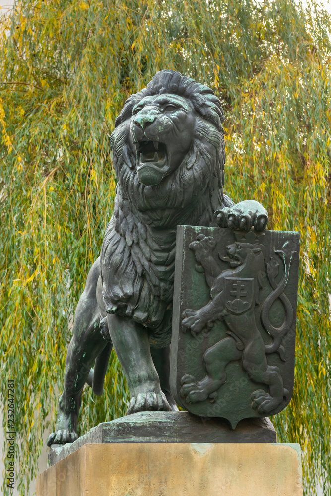 Bronze sculpture of lion on the yard of Strahov Monastery