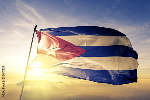 Canvas Print Cuba Cuban flag textile cloth fabric waving on the top sunrise mist fog