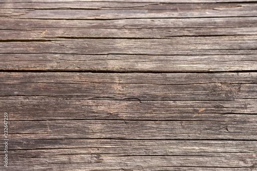 Brown wooden horizontal planks. Aged grunge wooden panels. Organic wall decoration. Hardwood boards. Wooden texture closeup. 