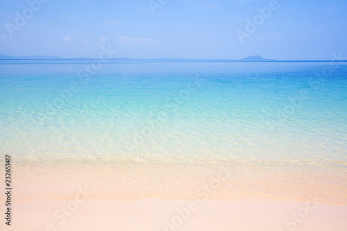 Tropical beach and turquoise blue sea on sunny summer.