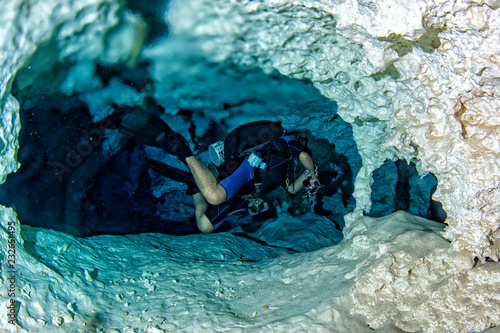 halocline effect while diving in cenotes cave in Mexico photo