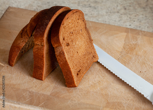 Veda bread with knife. Veda bread is a small malted loaf sold in Northern Ireland