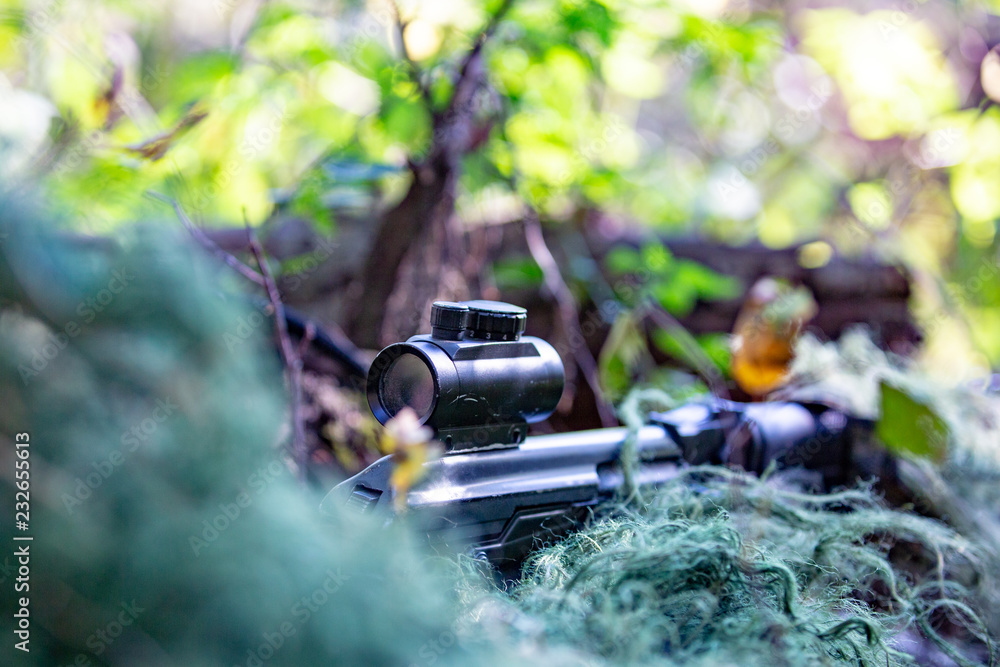 special forces, soldier assault rifle with silencer, optical sight. behind cover waiting in ambush special forces, soldier assault rifle with silencer, optical sight. behind cover waiting in ambush