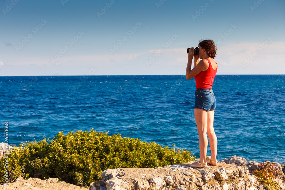 Adult woman taking pictures