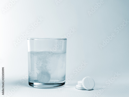 Closeup of a glass of water with effervescent tablets